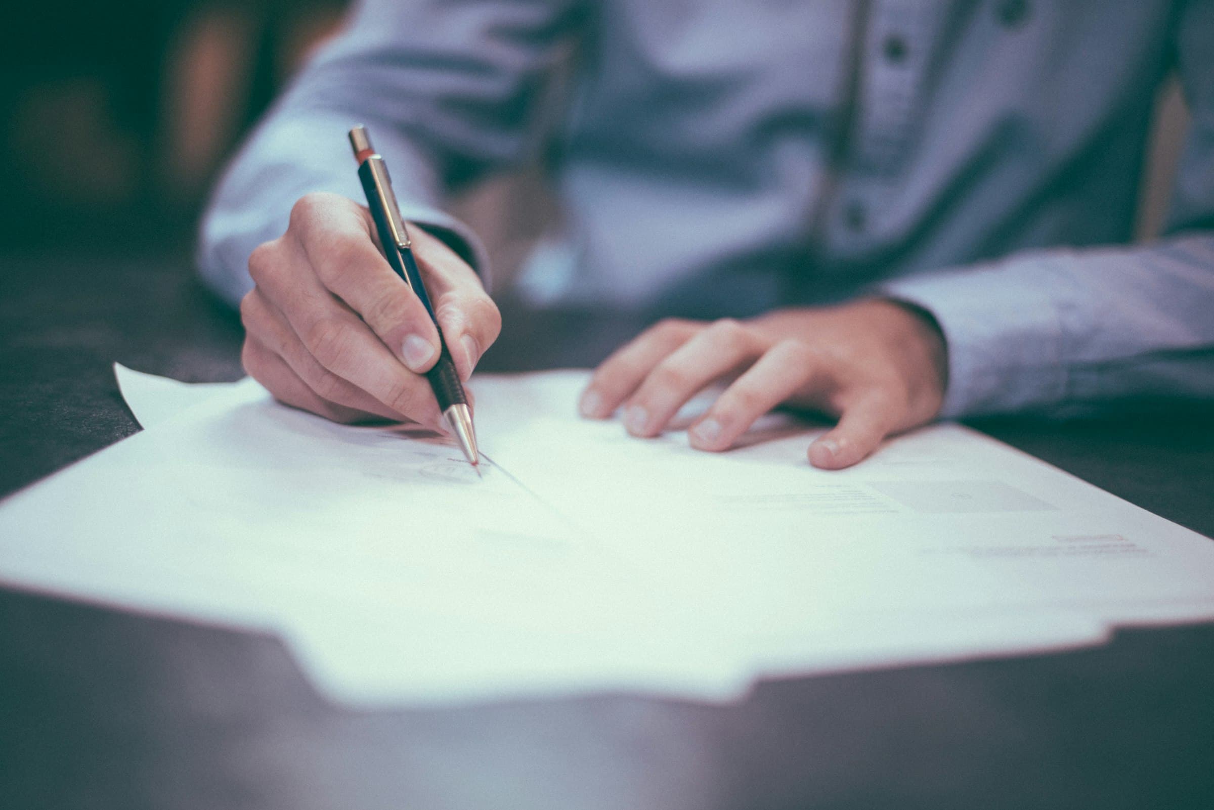 Contract documents on a desk